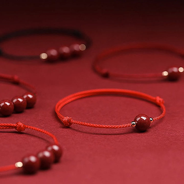 Rotes Armband Zinnober – Glück & Segen mit Perlen Flachlage Detail