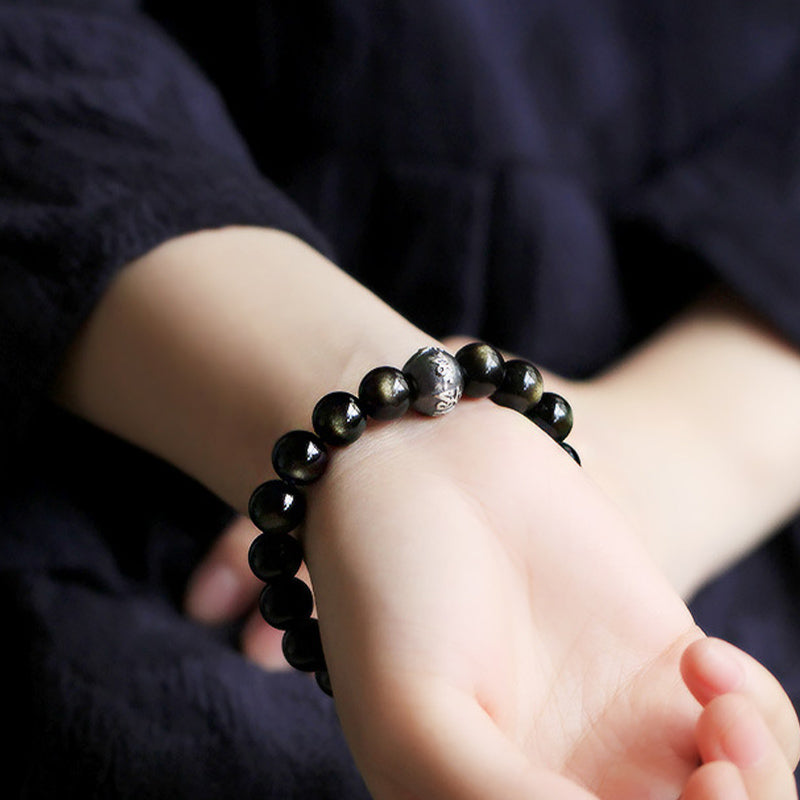 Armband Obsidian Chinesisches Tierkreis schwarze Perlen Handgelenk getragen