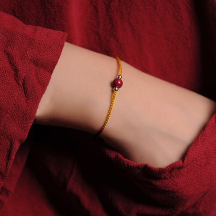 Armband Zinnober – Segen & Segen goldene Kette rote Perle Handgelenk