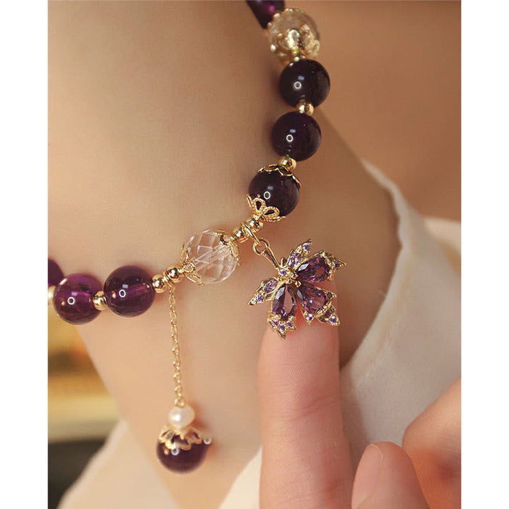 Amethyst Armband mit Kristall Charm und goldenem Schmettling Anhänger