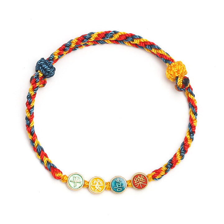 Armband – Schutz & Frieden mit farbigen Seilen und vier Glückssymbolen.