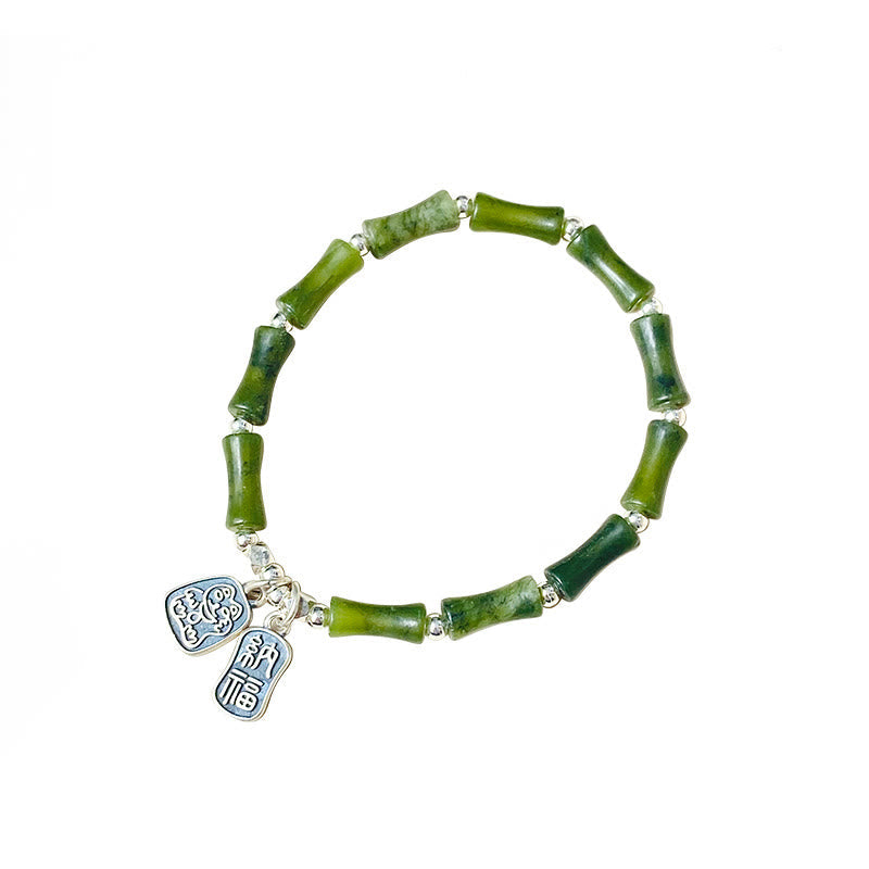 Grünes Jade Armband mit silbernen Fu-Zeichen Anhängern Glück Fülle.