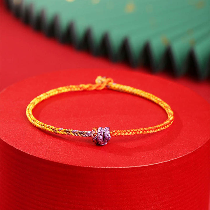 Armband Bunt Lila Gold Rot elastisch geflochtenes Seil Design