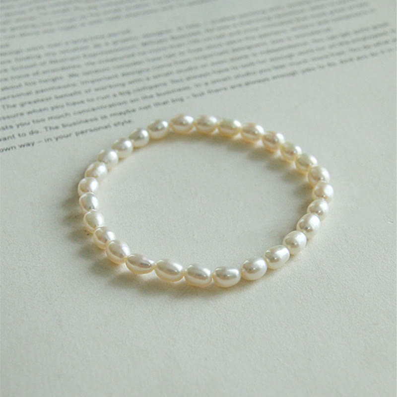 Armband Perle – Heilung, elastisches Perlenarmband mit weißen Naturperlen