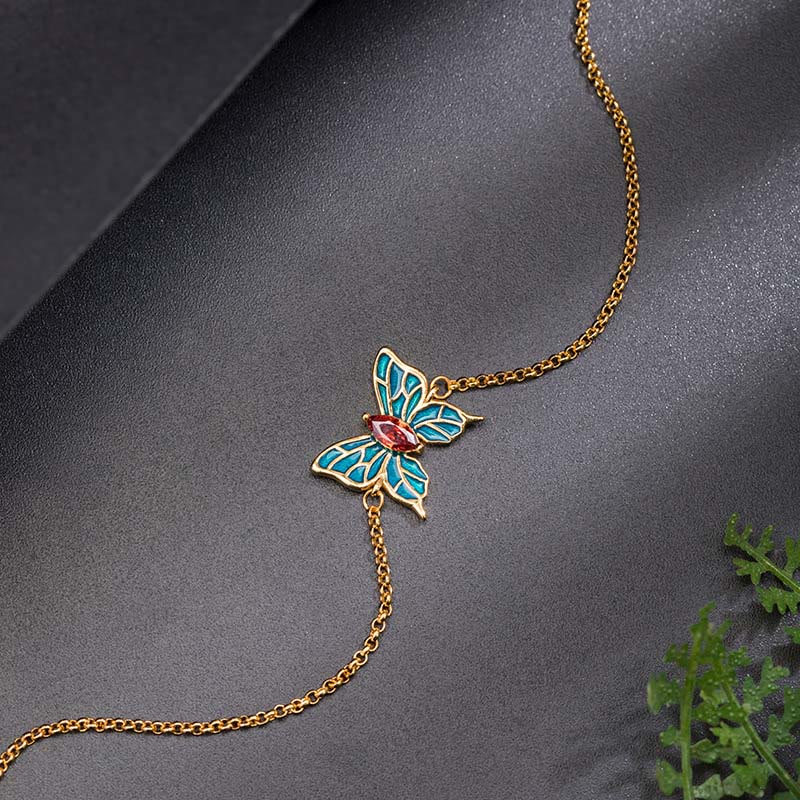 Goldenes Armband mit emailliertem Schmetterling Anhänger Schmuck.