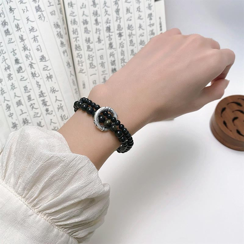 Obsidian Armband 925 Silber am Handgelenk getragen schwarzer Stein elegant