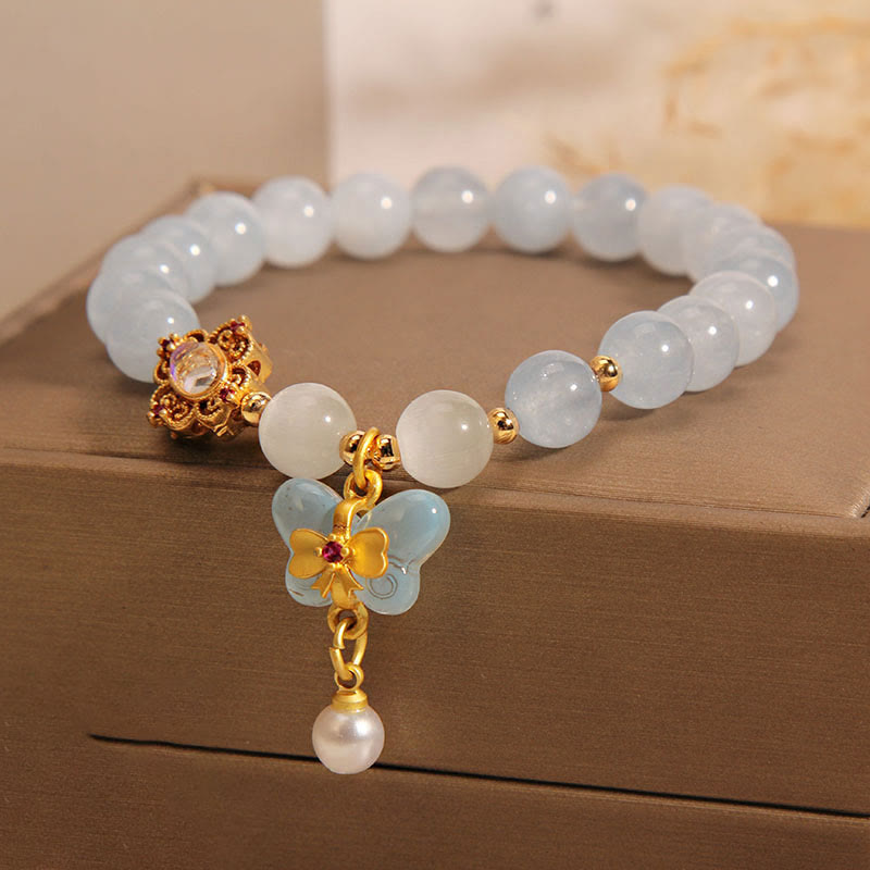 Aquamarin Perlenarmband mit Schmetterling und Perle Anhänger elegant.