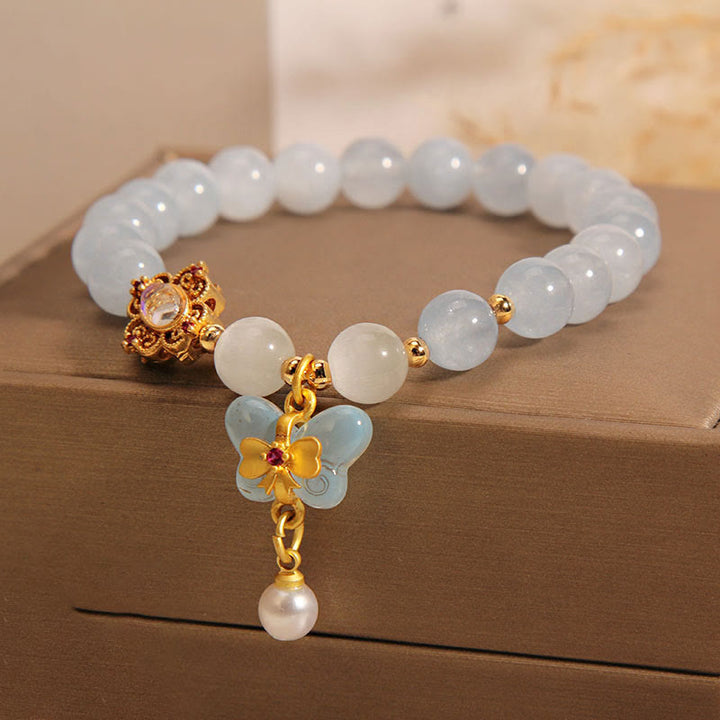 Aquamarin Perlenarmband mit Schmetterling und Perle Anhänger elegant.