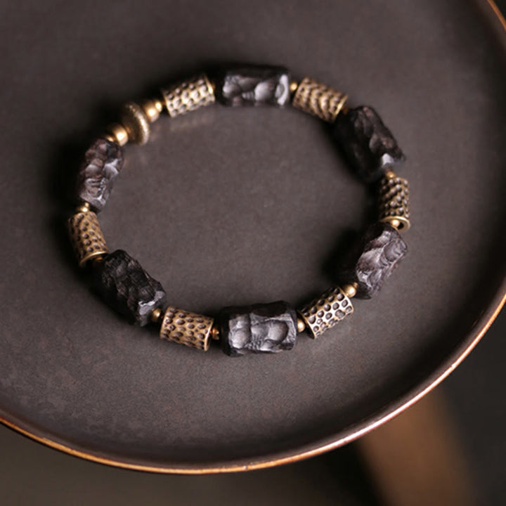 Armband Kupfer Ebenholz Frieden Ruhe schwarze Perlen golden glänzend elegant