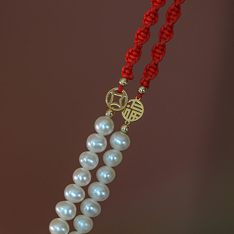 Armband Perle – Schutz & Glück mit roten Kordeln und goldenem Anhänger