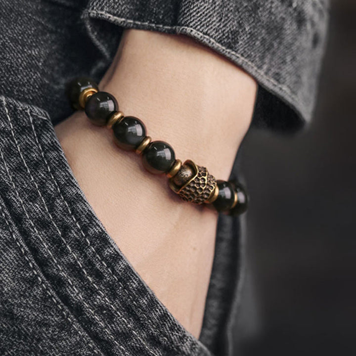 Armband Obsidian Kupfer schwarze Perlen Naturstein elegant am Handgelenk