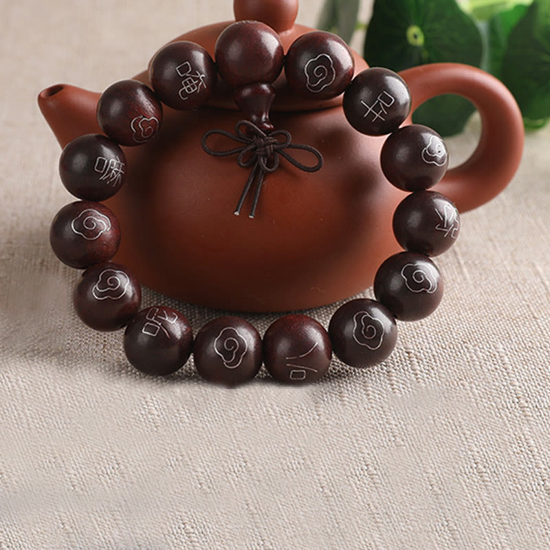 Braunes Sandelholz Armband mit Om-Symbolen und Teepot-Dekoration elegant.