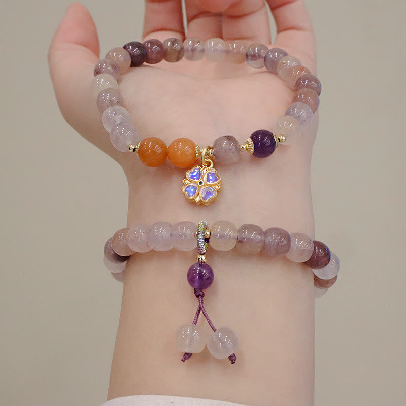 Jade Armband Wohlstand Stärke mit lila Amethyst und orangenen Perlen.