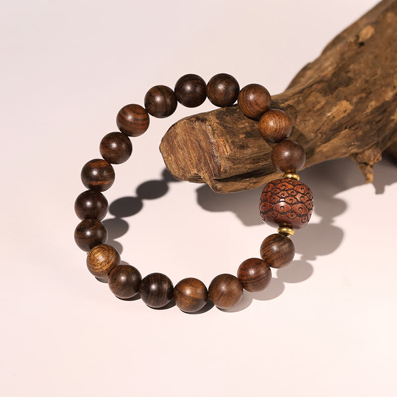 Armband Rosenholz Fu-Zeichen braune Perlen Holz elastisch natürlich
