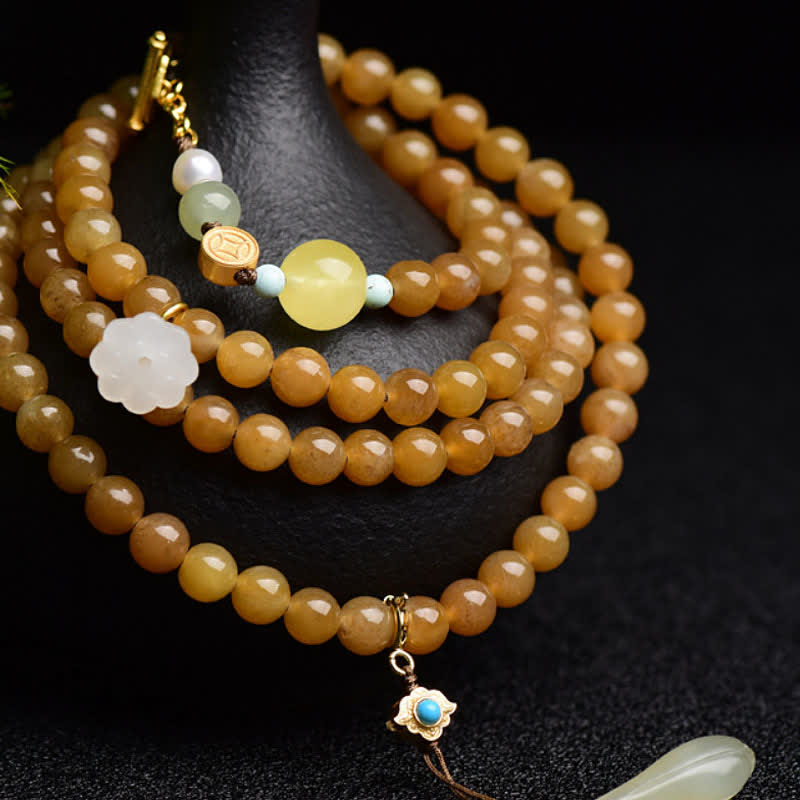 Armband mit weißer Jade, Perle und Lotus-Anhänger für Erfolg.