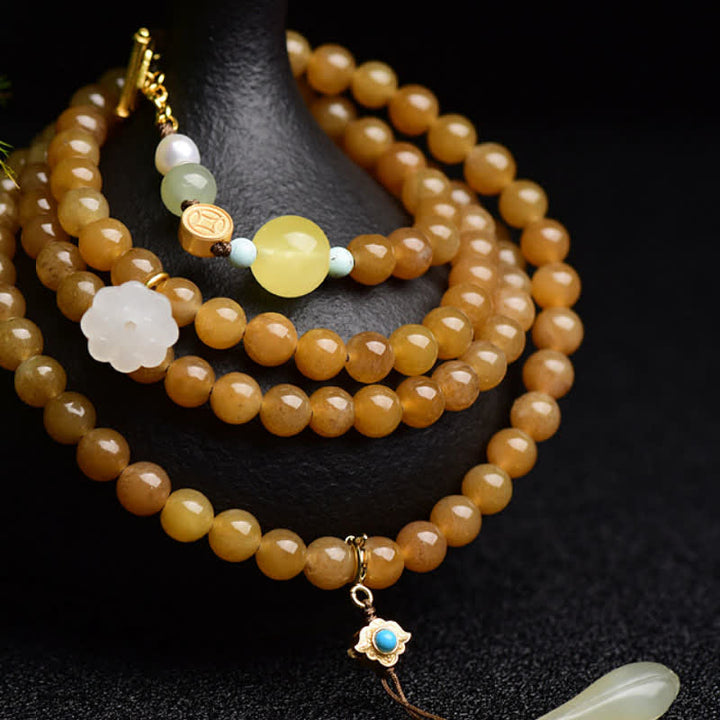 Armband mit weißer Jade, Perle und Lotus-Anhänger für Erfolg.