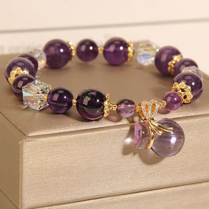 Armband Amethyst Kristall mit goldenen Perlen und Anhänger eleganz.