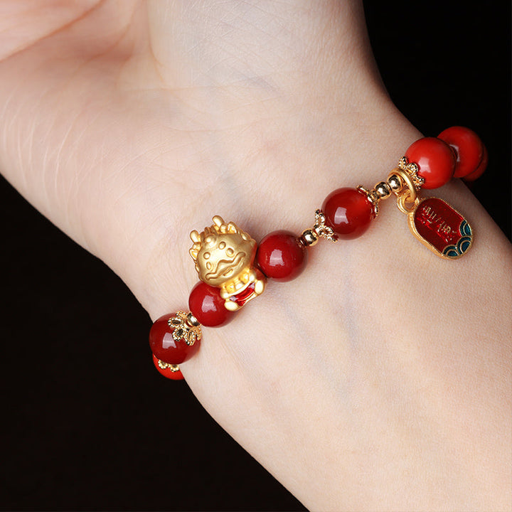 Armband Zinnober Drachen – Schutz goldener Buddha elastisch getragen