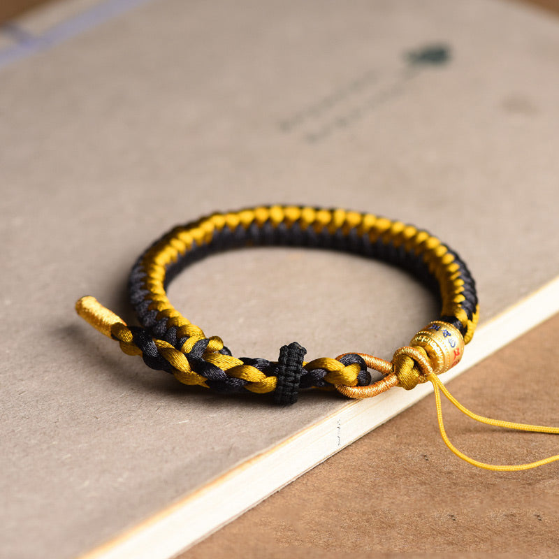 Schwarzes und goldenes geflochtenes Armband Om Mani Padme Hum elastisch