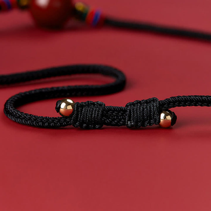 Tibetische Kette Zinnober Perle Segen schwarze Schnur vergoldet