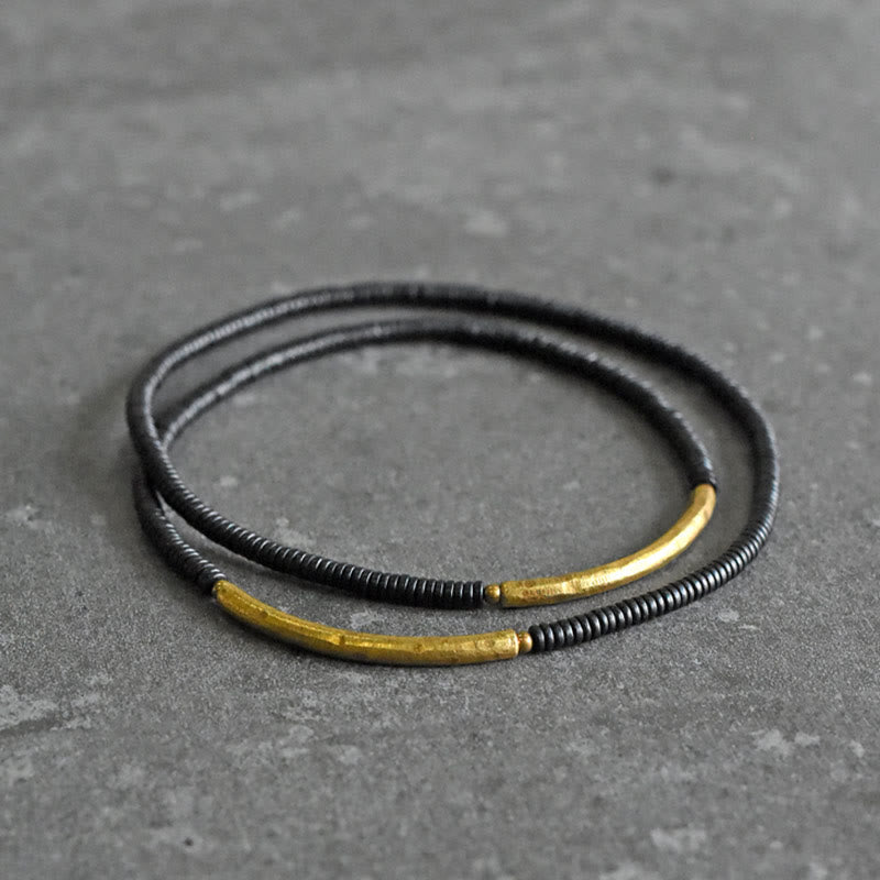 Armband Kupfer Ebenholz – Balance mit schwarzem Wickeldesign elegant.