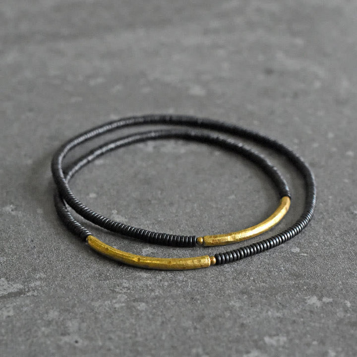 Armband Kupfer Ebenholz – Balance mit schwarzem Wickeldesign elegant.