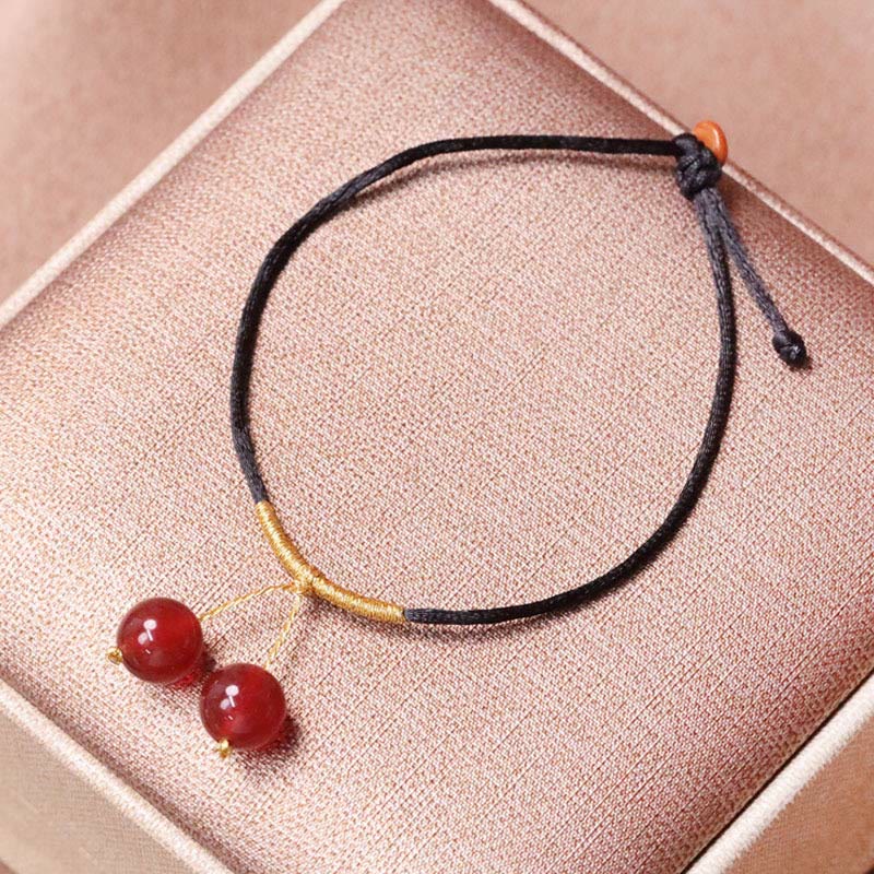 Armband Roter Achat – Balance mit schwarzer Kordel elastisch verstellbar.