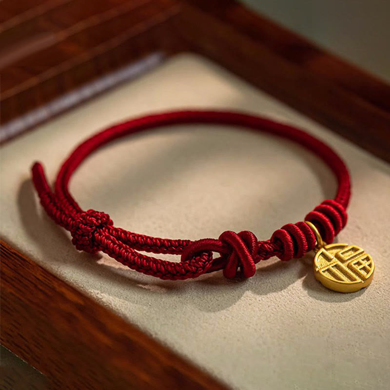 Rotes Armband Fu-Zeichen – Glück & Frieden mit goldenem Anhänger elegant