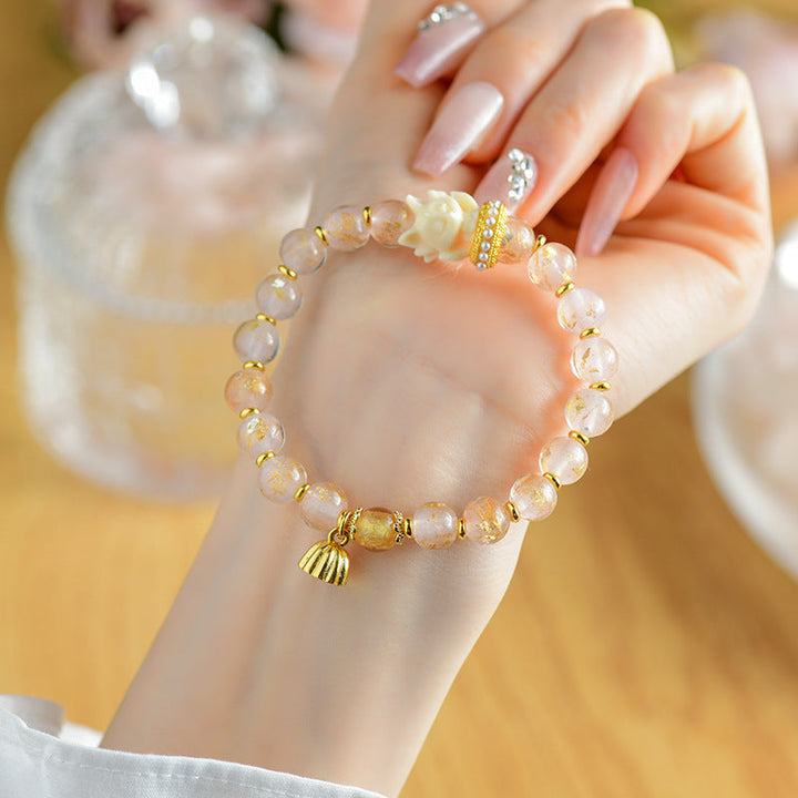 Armband Lotus – Glück mit Natursteinen und goldfarbenen Perlen elegant.