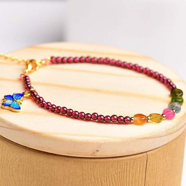 Armband Granat Schmetterling – Schutz rote Perlen bunte Steine elegant