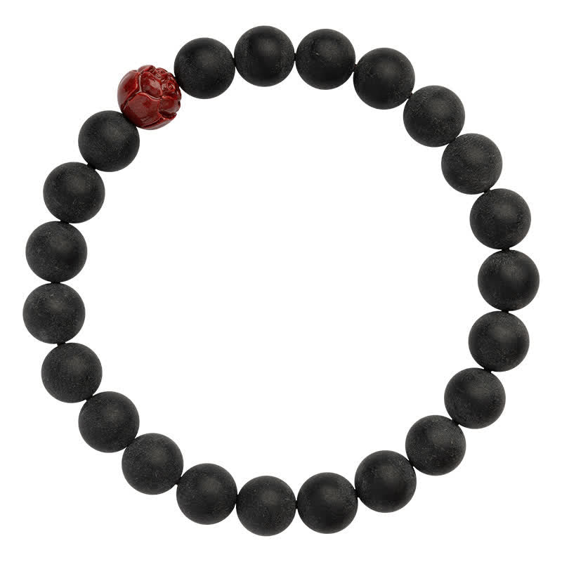 Armband Zinnober Lotus – Heilung schwarze Perlen rotes Ornament elastisch