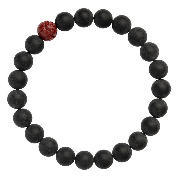 Armband Zinnober Lotus – Heilung schwarze Perlen rotes Ornament elastisch