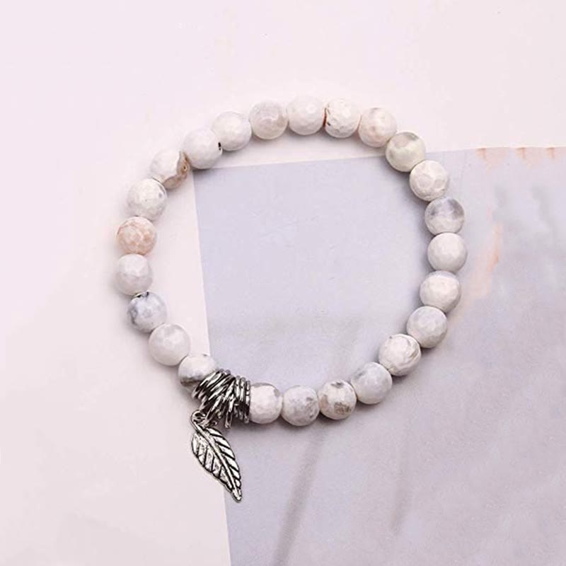 Weißes Naturstein Armband mit Silber Flügel Charm Anhänger elastisch