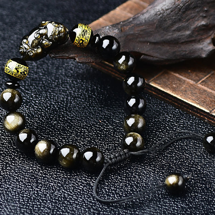 Schwarzes Obsidian Armband mit goldenen Om Mani Padme Hum Verschluss elegant