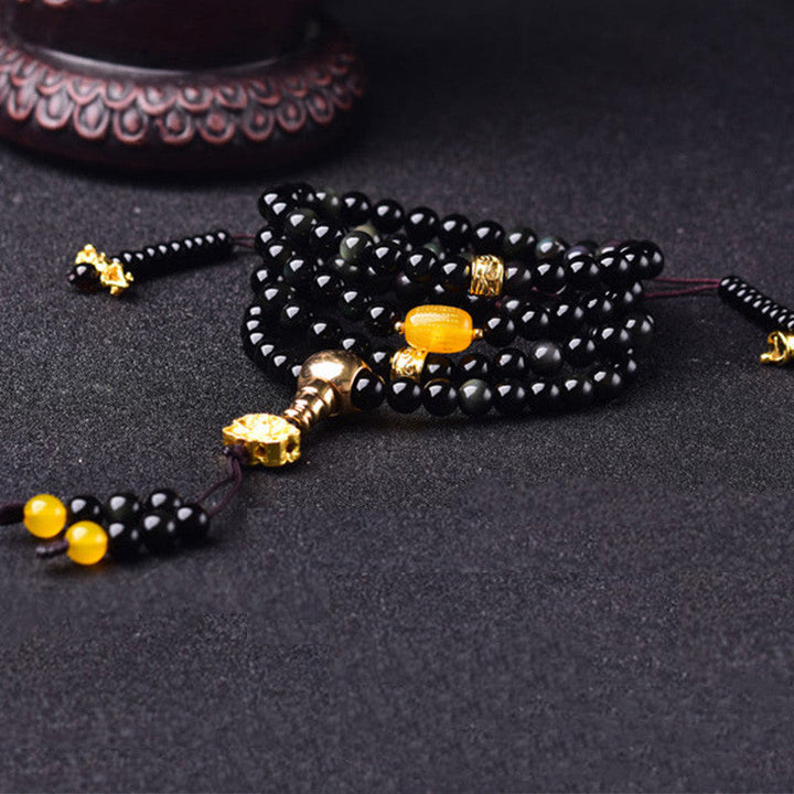 Armband Schwarzer Obsidian Lotus mit goldenen Perlen Accessoire