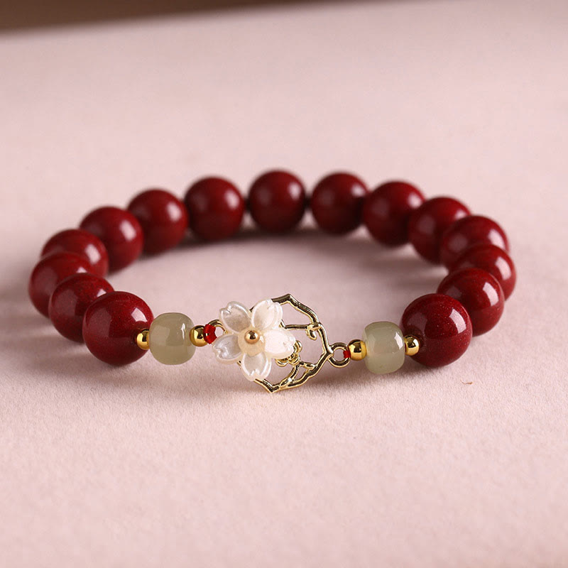 Armband Zinnober Jade – Segen rote Perlen elfenbeinfarben elegant