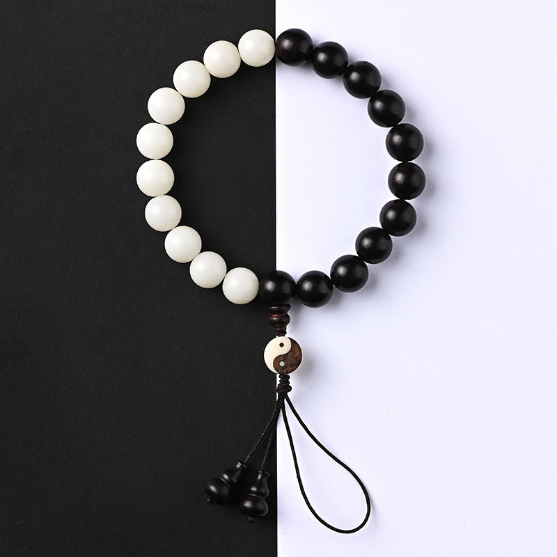 Armband Ebenholz Schutz Yin Yang weiß schwarz Perlen Quaste