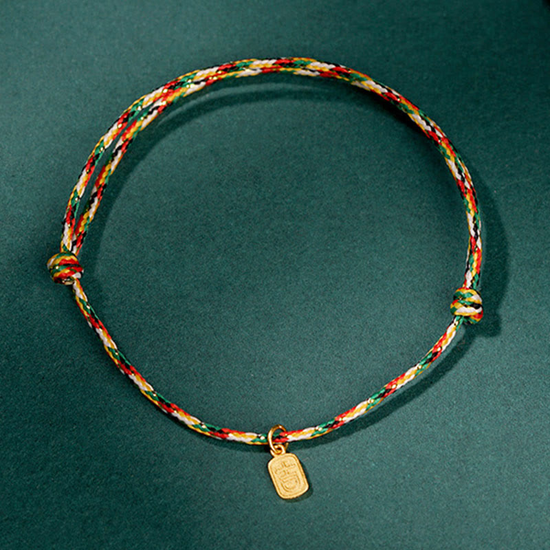 Armband Fu-Zeichen – Glück & Frieden & Energie mit buntem Seil und Goldanhänger.