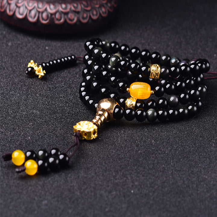 Armband Schwarzer Obsidian mit goldenem Lotus und Citrin Anhänger