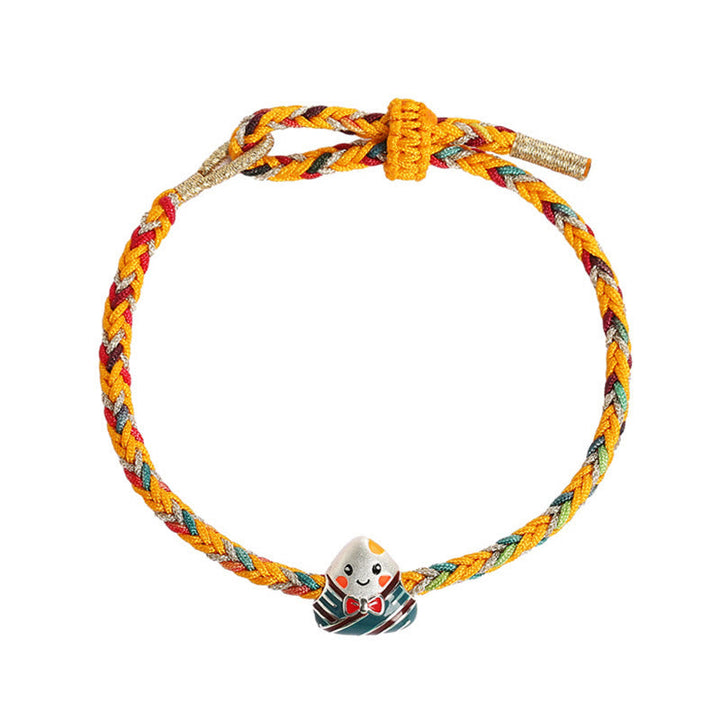 Buntes geflochtenes Armband mit süßer Enten-Charm Dekoration elastisch.