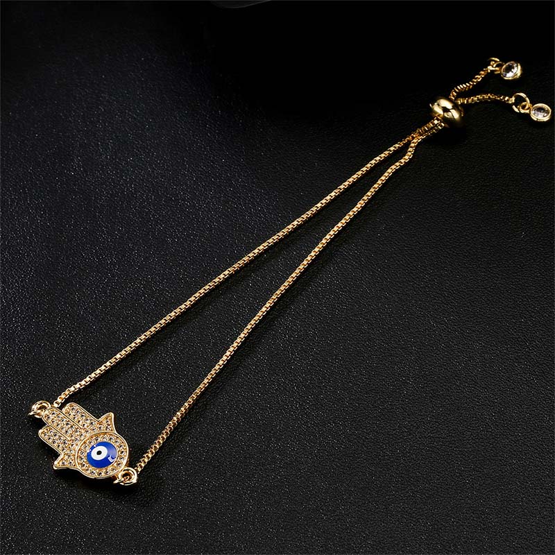 Goldenes Armband Böses Auge – Schutz & Mut mit blauem Auge Flachansicht.