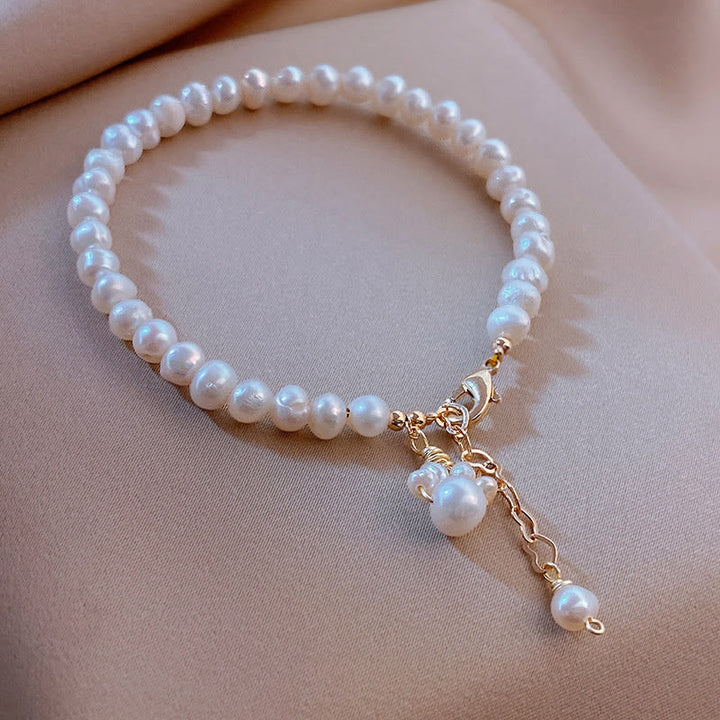 Elegantes Perlenarmband mit Katze Anhänger Heilung Rosegold