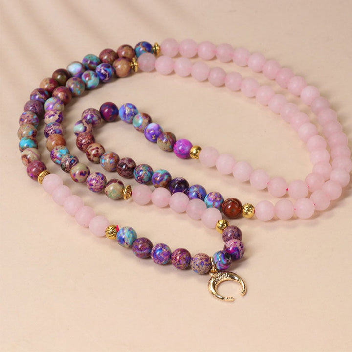 Mala 108 Rosenquarz Perlen flach arrangiert rosa Naturstein Heilung Balance Schmuck