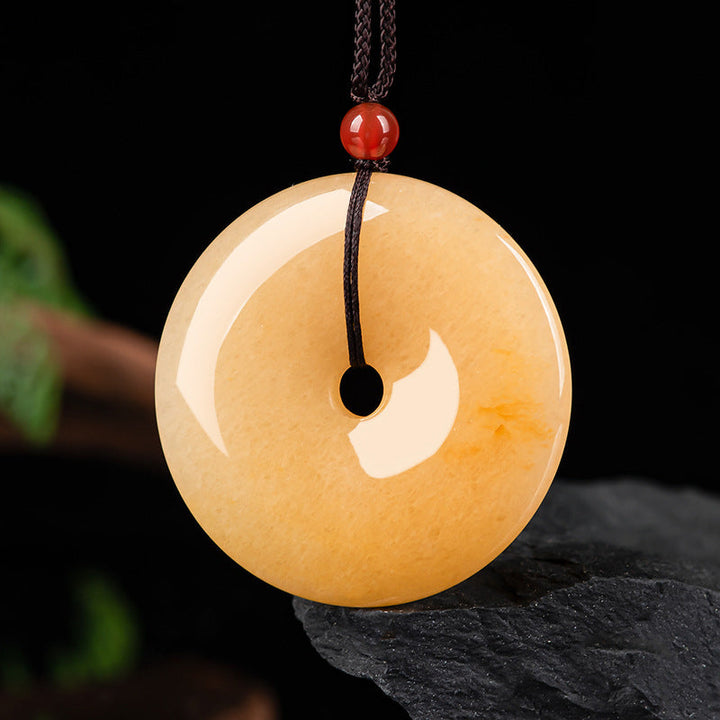 Kette goldene Jade Anhänger rund Naturstein