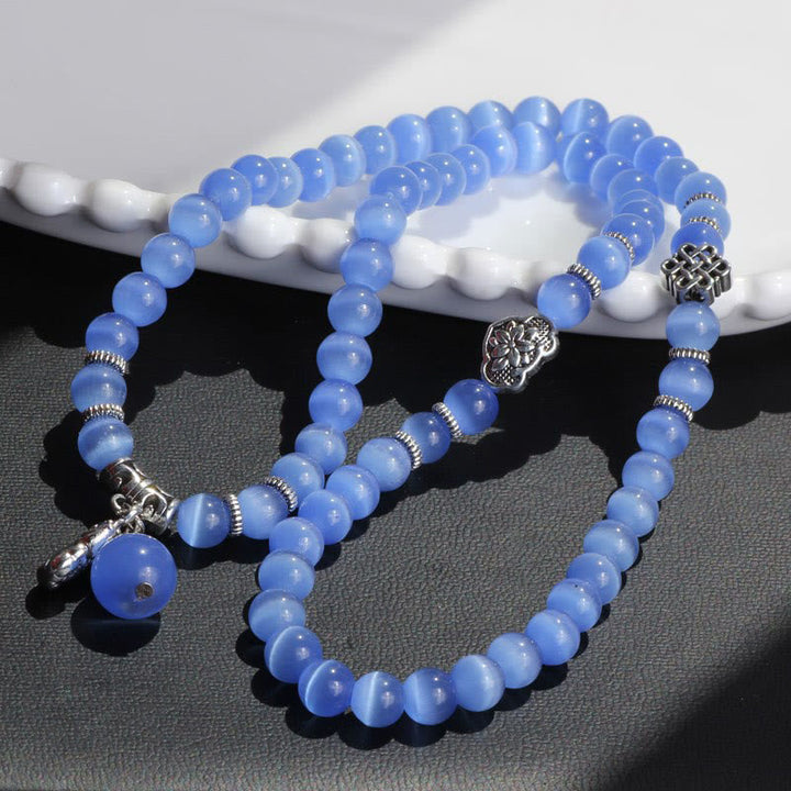 Blaues Katzenauge Armband PiXiu Dreifach elastisch Naturstein elegant.
