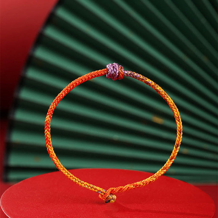 Armband Bunt Lila Gold Rot elastisch geflochtenes Seil Design.