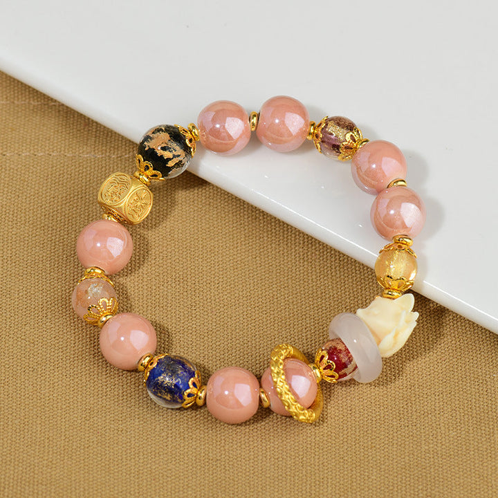 Rosenquarz Armband Fuchs mit goldenen Perlen Schutz Glück elegant