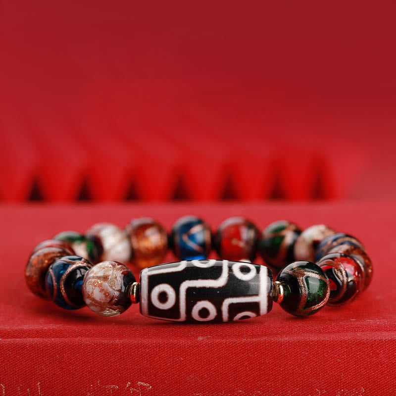 Armband – Wohlstand Balance mit schwarzem Dzi-Stein und bunten Perlen