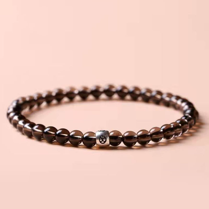 Armband Schwarzer Obsidian Katze – Stärke mit braunen Perlen Flatlay Ansicht