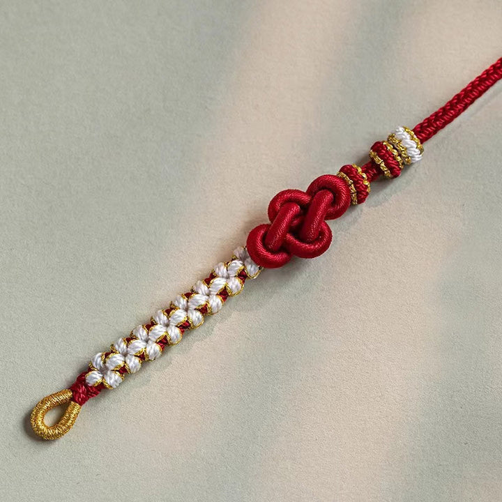Rotes Armband Pfirsichblüte mit weißen Perlen Glück Liebe elastisch.